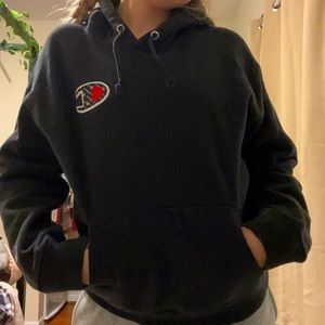 This is a black champion hoodie it’s been worn a lot but it’s still cute